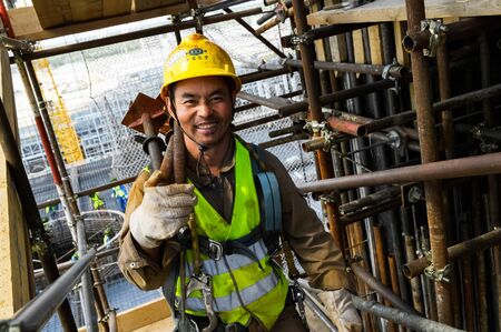 Tobolsk, Russia - June 14, 2018: Worker at the factory. Construction of a petrochemical and oil refinery near the city of Tobolsk in Russia, workers working on the installation and construction of the plant.のeditorial素材