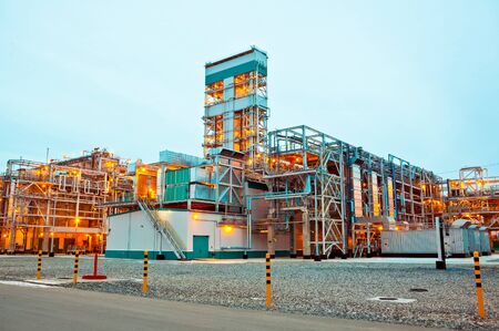 Construction of a petrochemical and oil refinery near the city of Tobolsk in Russia, workers working...