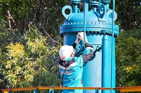 Tobolsk, Russia - June 14, 2018: Construction of a petrochemical and oil refinery near the city of Tobolsk in Russia, workers working on the installation and construction of the plant.のeditorial素材
