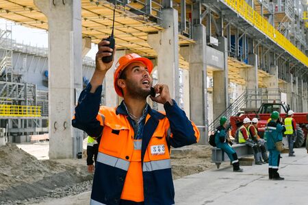 Tobolsk, Russia - June 14, 2018: Worker at the factory. Construction of a petrochemical and oil refinery near the city of Tobolsk in Russia, workers working on the installation and construction of the plant.のeditorial素材