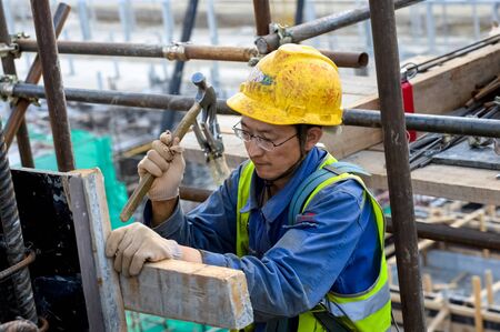 Tobolsk, Russia - June 14, 2018: Worker at the factory. Construction of a petrochemical and oil refinery near the city of Tobolsk in Russia, workers working on the installation and construction of the plant.のeditorial素材