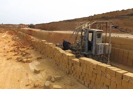 Shell quarry quarry. Cutting a seashell into blocks right away in a quarry.の写真素材