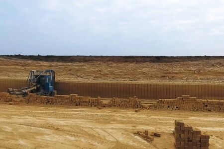 Shell quarry quarry. Cutting a seashell into blocks right away in a quarry.