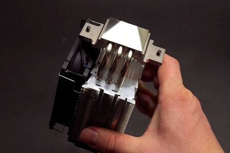 CPU cooling system. Cooler with a radiator in the hands of a manの写真素材