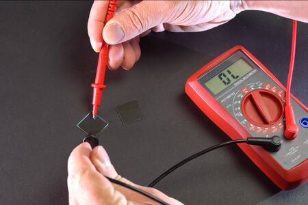Measurement of product electrical parameters using a multimeter.の写真素材