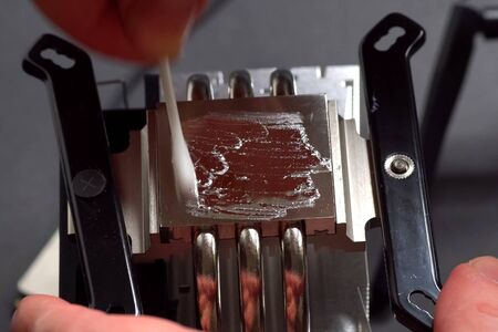 Application of liquid metal to the radiator of the central processor cooling system.の写真素材