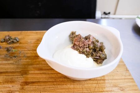 Minced meat with mushrooms in a plate. Cooking.の写真素材