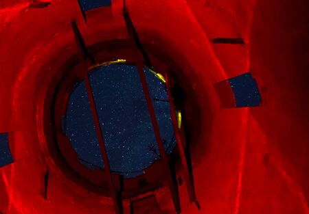View of the starry sky through the opening of the water tower. Stars in the sky.の写真素材