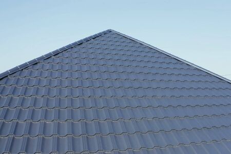 Modern roof made of metal. Corrugated metal roof and metal roofing.