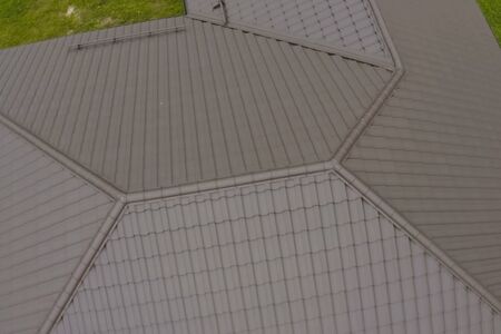 Modern roof made of metal. Corrugated metal roof and metal roofing.の写真素材