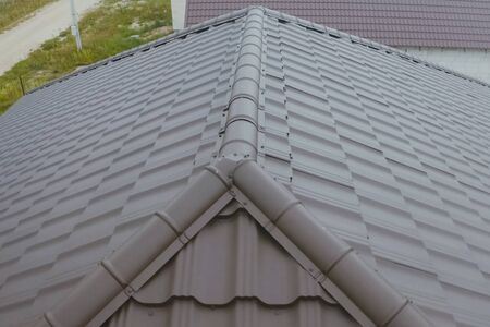 Modern roof made of metal. Corrugated metal roof and metal roofing.の写真素材