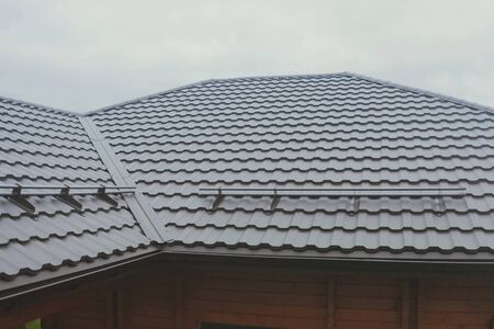 Modern roof made of metal. Corrugated metal roof and metal roofing.の写真素材