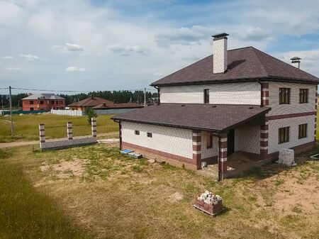 House with a roof from a bituminous tile. Bituminous tile for a roof. a roof from a bituminous tile.の写真素材
