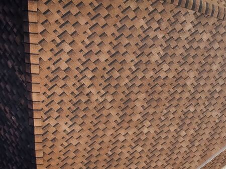 House with a roof from a bituminous tile. Bituminous tile for a roof. a roof from a bituminous tile.の写真素材