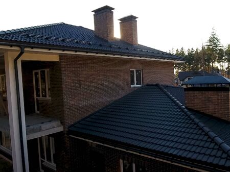 House with a ceramic tile roof. cement-sand roof tiles.の写真素材