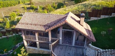 House with a ceramic tile roof. cement-sand roof tiles.の写真素材