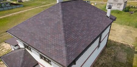 House with a roof from a bituminous tile. Bituminous tile for a roof. a roof from a bituminous tile.の写真素材