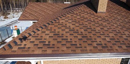 House with a roof from a bituminous tile. Bituminous tile for a roof. a roof from a bituminous tile.の写真素材