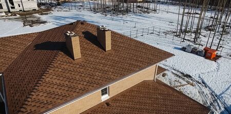 House with a roof from a bituminous tile. Bituminous tile for a roof. a roof from a bituminous tile.の写真素材