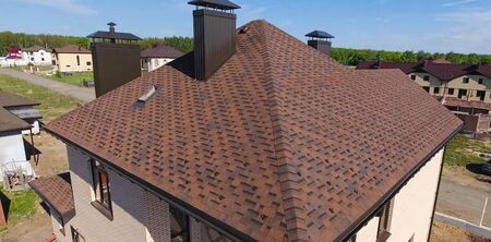 House with a roof from a bituminous tile. Bituminous tile for a roof. a roof from a bituminous tile.の写真素材