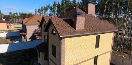 House with a roof from a bituminous tile. Bituminous tile for a roof. a roof from a bituminous tile.の写真素材