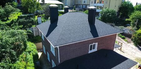 House with a roof from a bituminous tile. Bituminous tile for a roof. a roof from a bituminous tile.の写真素材