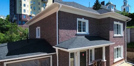 House with a roof from a bituminous tile. Bituminous tile for a roof. a roof from a bituminous tile.の写真素材