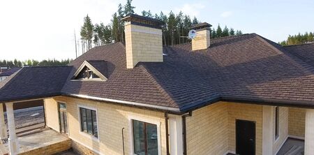 House with a roof from a bituminous tile. Bituminous tile for a roof. a roof from a bituminous tile.の写真素材