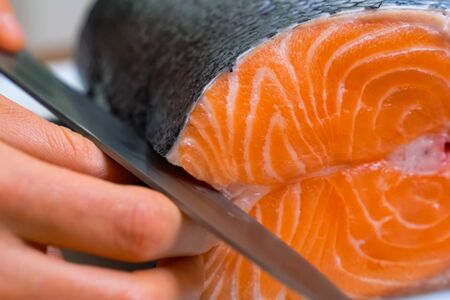 a Butchering salmon, piece of salmon red fish meat.の写真素材