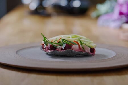 Salad on a plate. Beets, fish fillet and onions.の写真素材