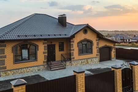 A new house, the roof of which is made of metal. Cottage in the countryside. roof made of modern materials.の写真素材