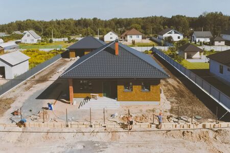 A new house, the roof of which is made of metal. Cottage in the countryside. roof made of modern materials.の写真素材