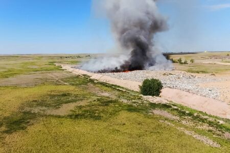 Burning trash. fire at the landfill. Burning garbage. Garbage dump, top view of the trash. Landfill.の写真素材