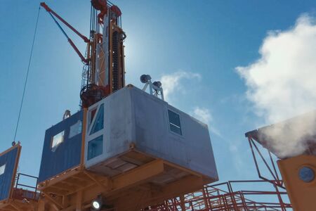 Drilling rig, equipment at the site of oil drilling.