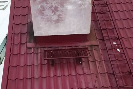 Modern roof made of metal. Corrugated metal roof and metal roofing.の写真素材