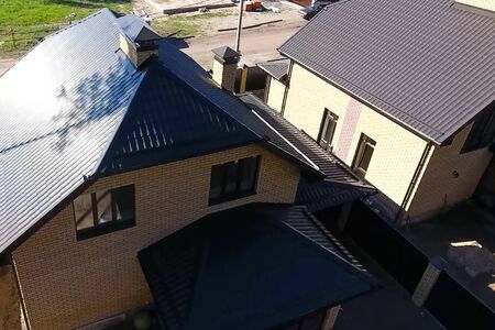 Modern roof made of metal. Corrugated metal roof and metal roofing.の写真素材