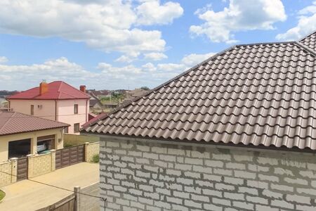 Modern roof made of metal. Corrugated metal roof and metal roofing.の写真素材