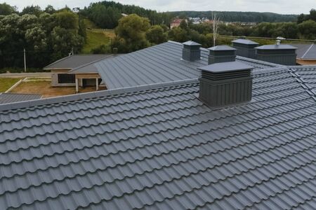 Modern roof made of metal. Corrugated metal roof and metal roofing.の写真素材