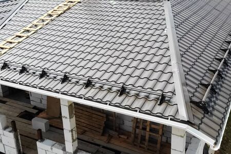 Modern roof made of metal. Corrugated metal roof and metal roofing.