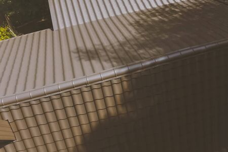 Modern roof made of metal. Corrugated metal roof and metal roofing.の写真素材