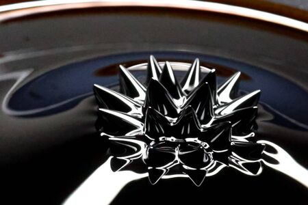 Beautiful forms of ferromagnetic fluid. Iron dissolved in a liquid under the influence of a magnetic fieldの写真素材