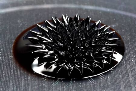 Beautiful forms of ferromagnetic fluid. Iron dissolved in a liquid under the influence of a magnetic fieldの写真素材
