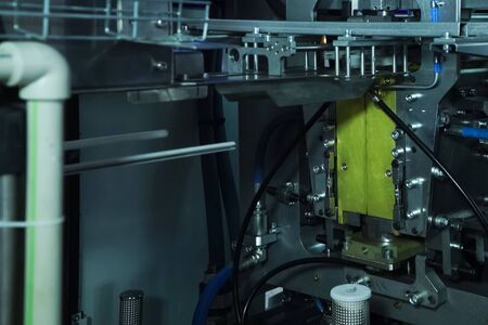Filling line of sparkling water in a pet bottle. Mini factory for bottling water.の写真素材