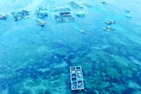 Fish farm in coastal waters. Rectangular cages for fish and crustaceans.の写真素材