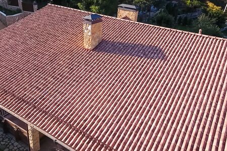 House with a ceramic tile roof. cement-sand roof tiles.の写真素材