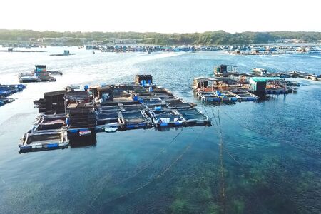 Fish farm in coastal waters. Rectangular cages for fish and crustaceans.の写真素材
