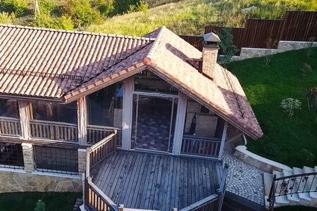 House with a ceramic tile roof. cement-sand roof tiles.の写真素材
