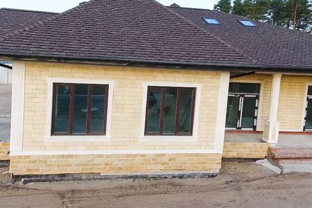 House with a roof from a bituminous tile. Bituminous tile for a roof. a roof from a bituminous tile.の写真素材