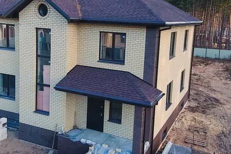 House with a roof from a bituminous tile. Bituminous tile for a roof. a roof from a bituminous tile.の写真素材