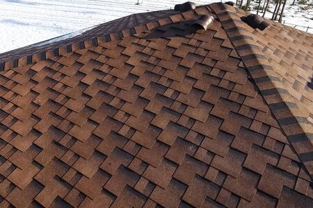 House with a roof from a bituminous tile. Bituminous tile for a roof. a roof from a bituminous tile.の写真素材